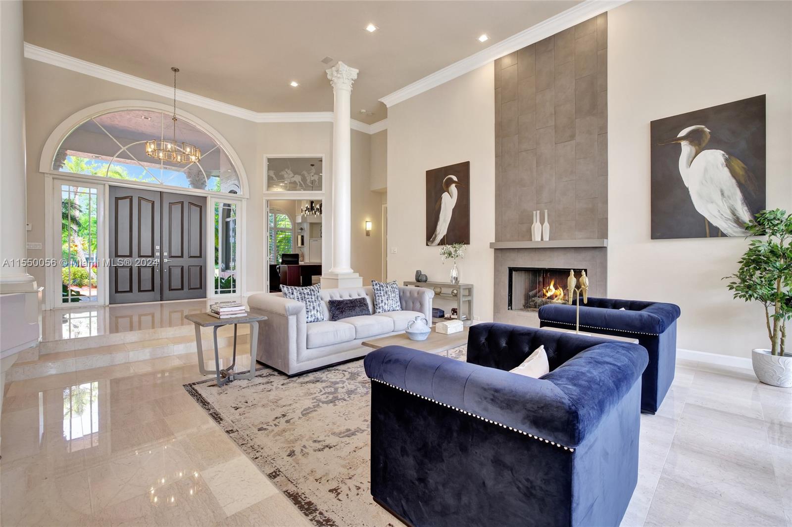 2725 Windmill Ranch Road Weston, FL 33331 - Photo 16 of 99 a living room with fireplace furniture and a large window