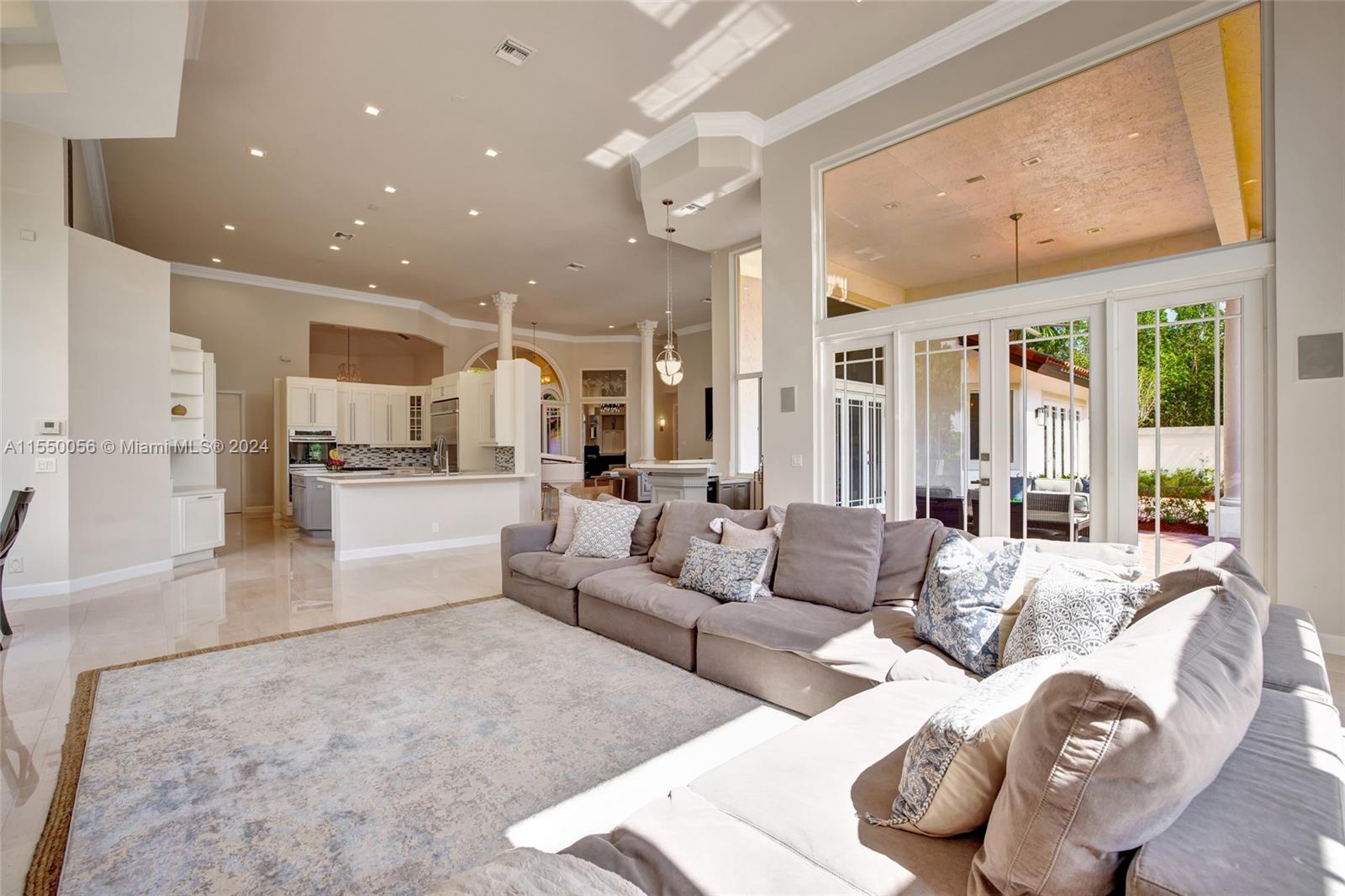 2725 Windmill Ranch Road Weston, FL 33331 - Photo 25 of 99 a living room with furniture and a large window