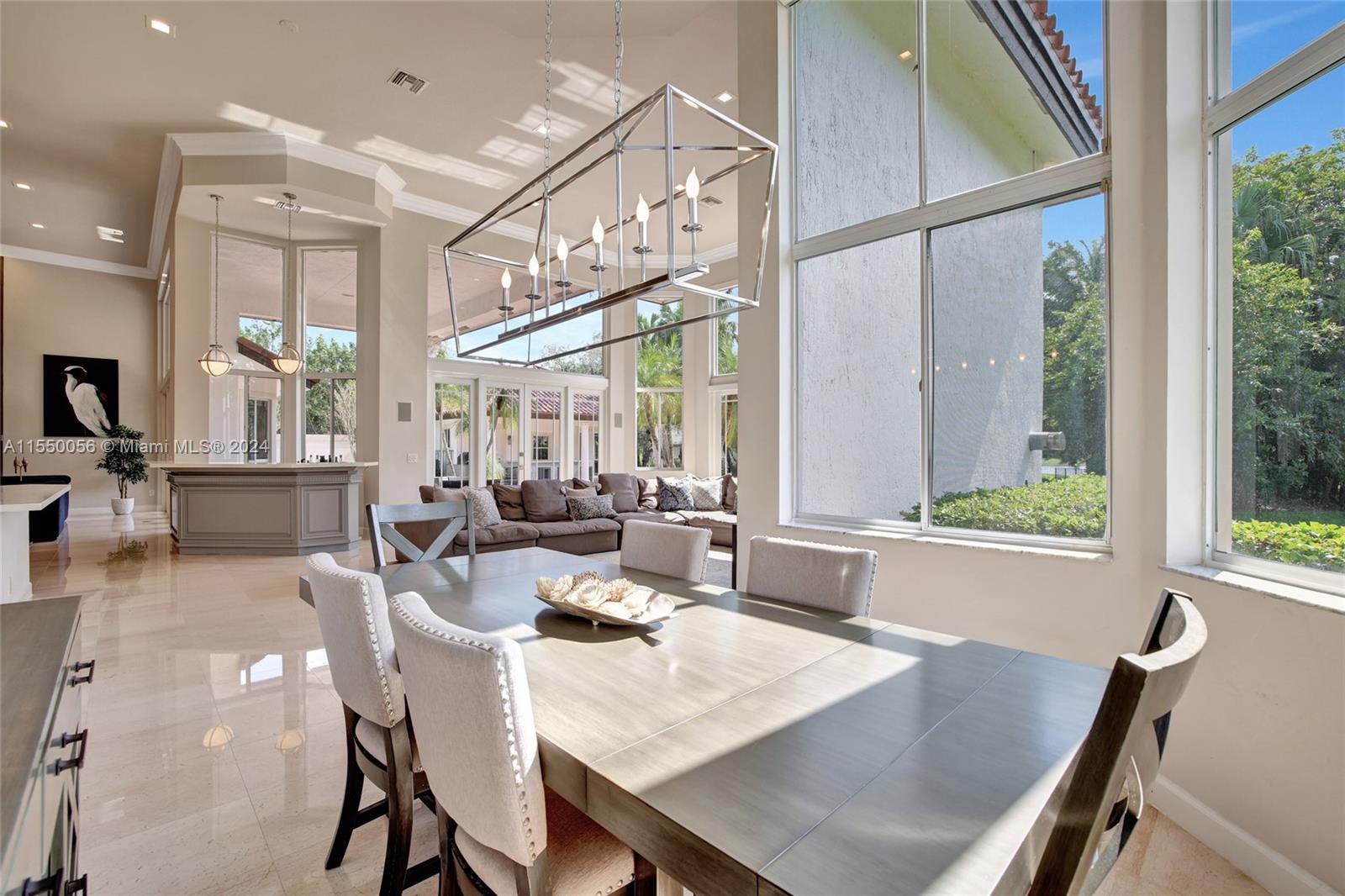 2725 Windmill Ranch Road Weston, FL 33331 - Photo 27 of 99 a view of a dining room with furniture window and outside view
