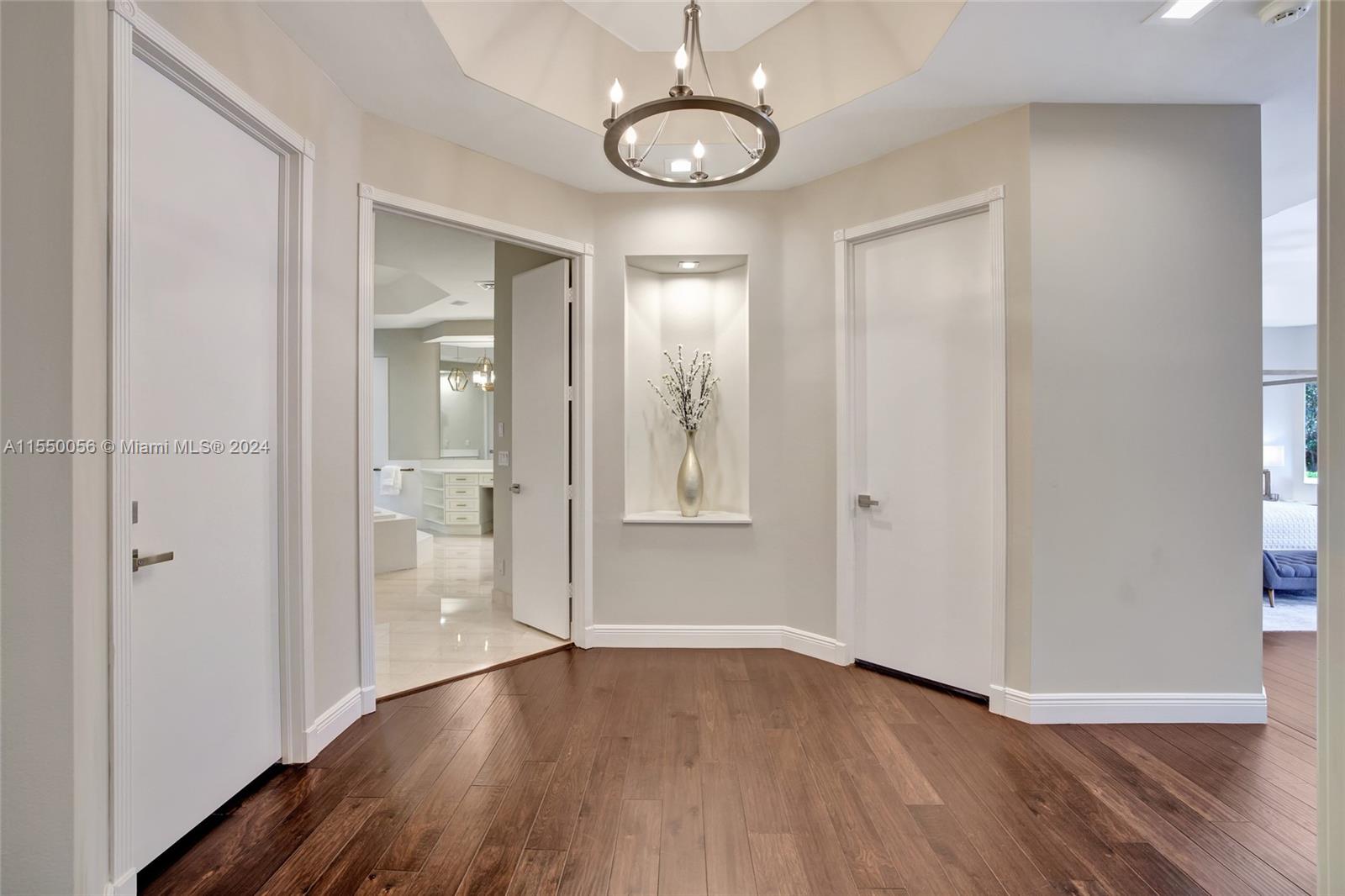 2725 Windmill Ranch Road Weston, FL 33331 - Photo 35 of 99 a view of an empty room with wooden floor and a window