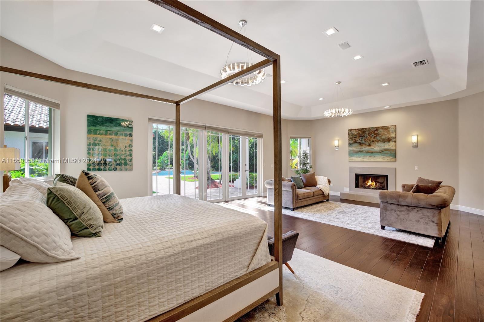 2725 Windmill Ranch Road Weston, FL 33331 - Photo 37 of 99 a bedroom with furniture large window and fireplace