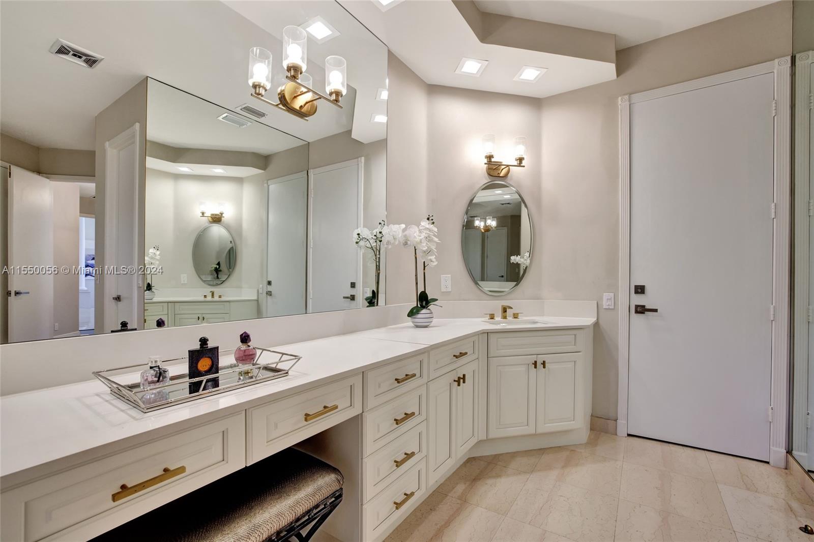 2725 Windmill Ranch Road Weston, FL 33331 - Photo 41 of 99 a spacious bathroom with a double vanity sink and a mirror