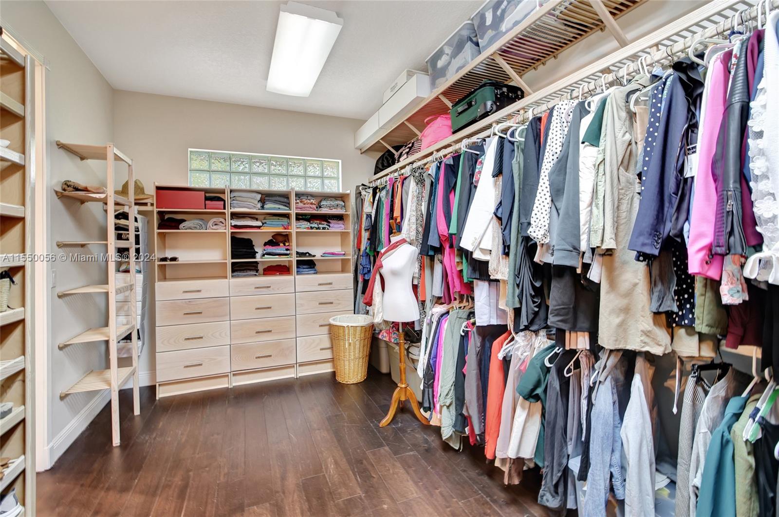 2725 Windmill Ranch Road Weston, FL 33331 - Photo 44 of 99 a view of walk in closet with clothes and shoes