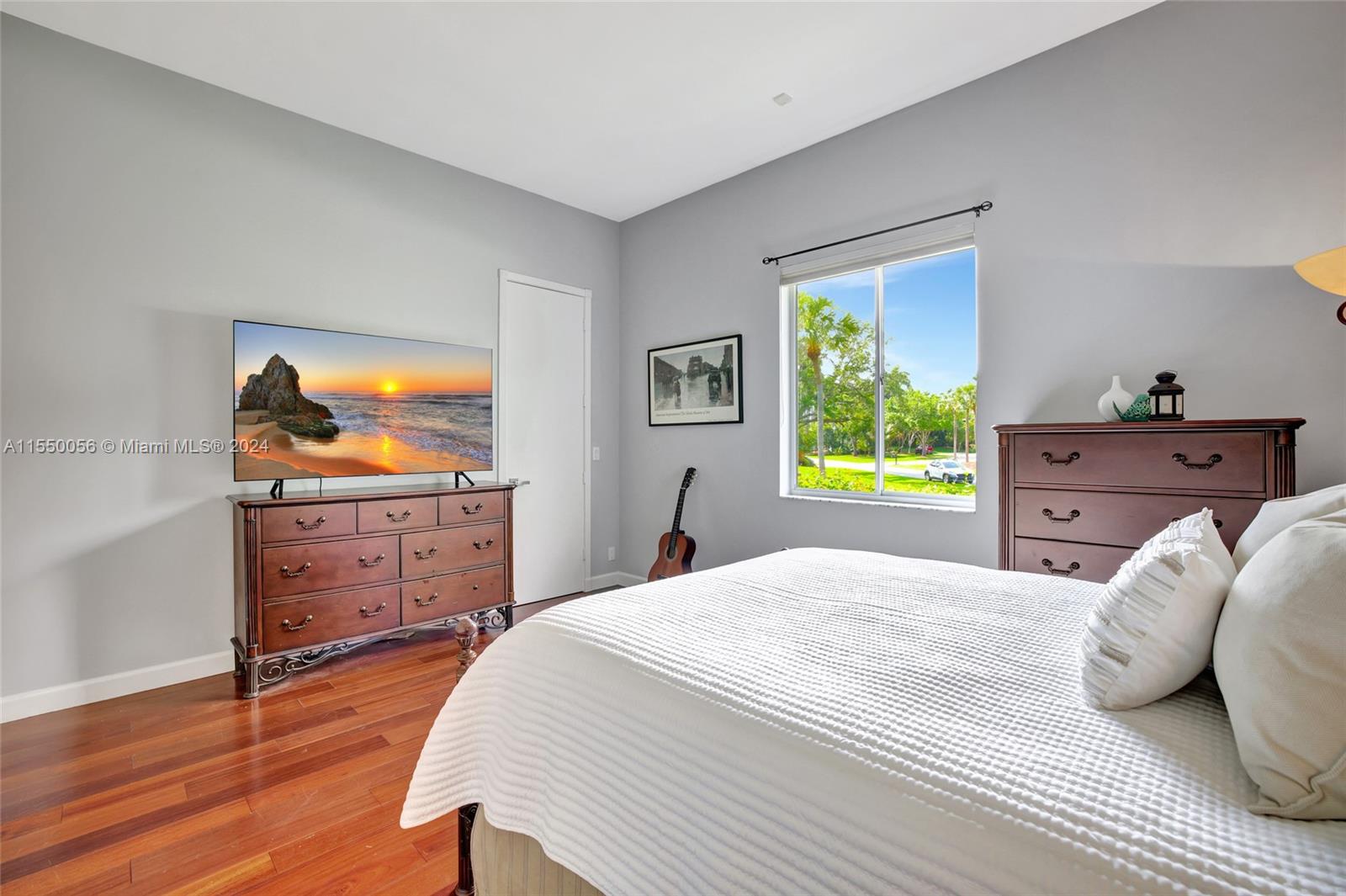 2725 Windmill Ranch Road Weston, FL 33331 - Photo 52 of 99 a bedroom with a bed and a dresser in it