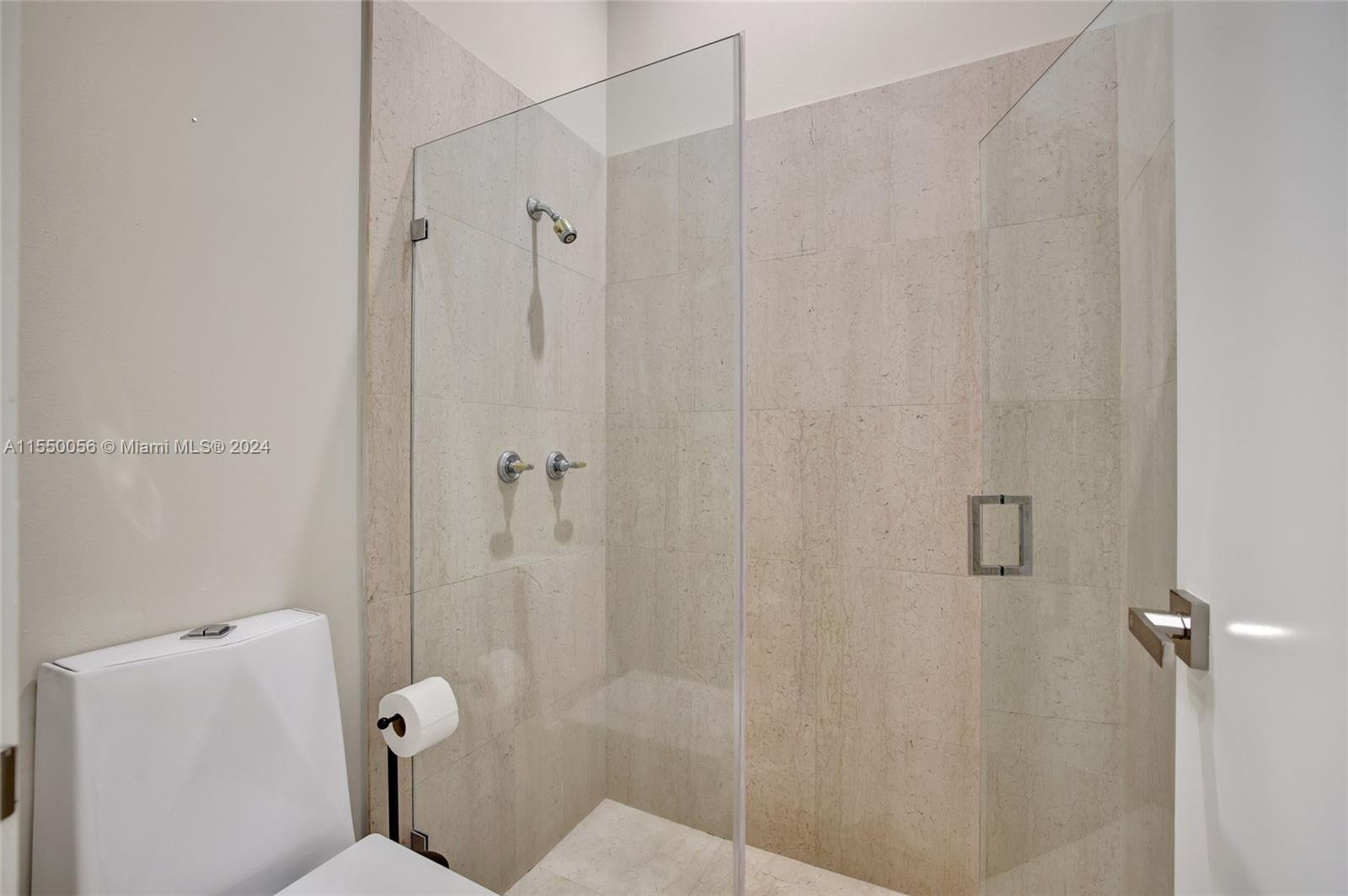2725 Windmill Ranch Road Weston, FL 33331 - Photo 54 of 99 a bathroom with a shower and toilet