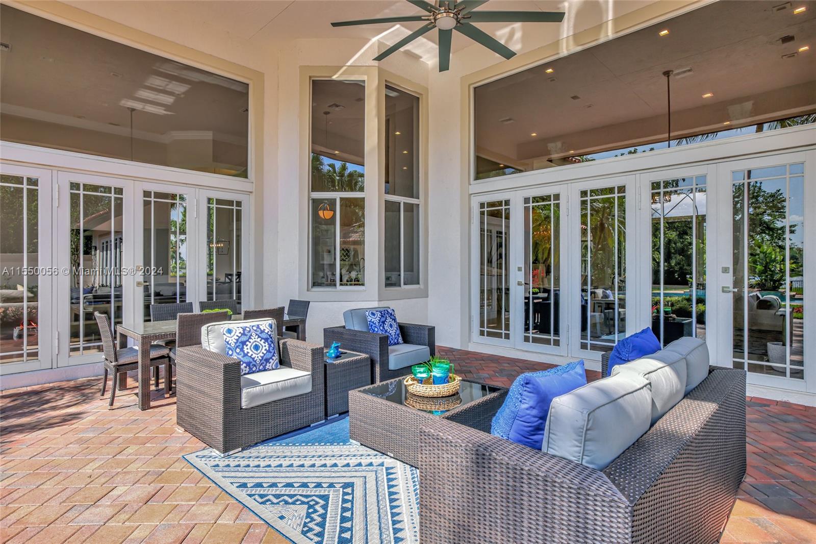2725 Windmill Ranch Road Weston, FL 33331 - Photo 64 of 99 a living room with furniture and floor to ceiling windows