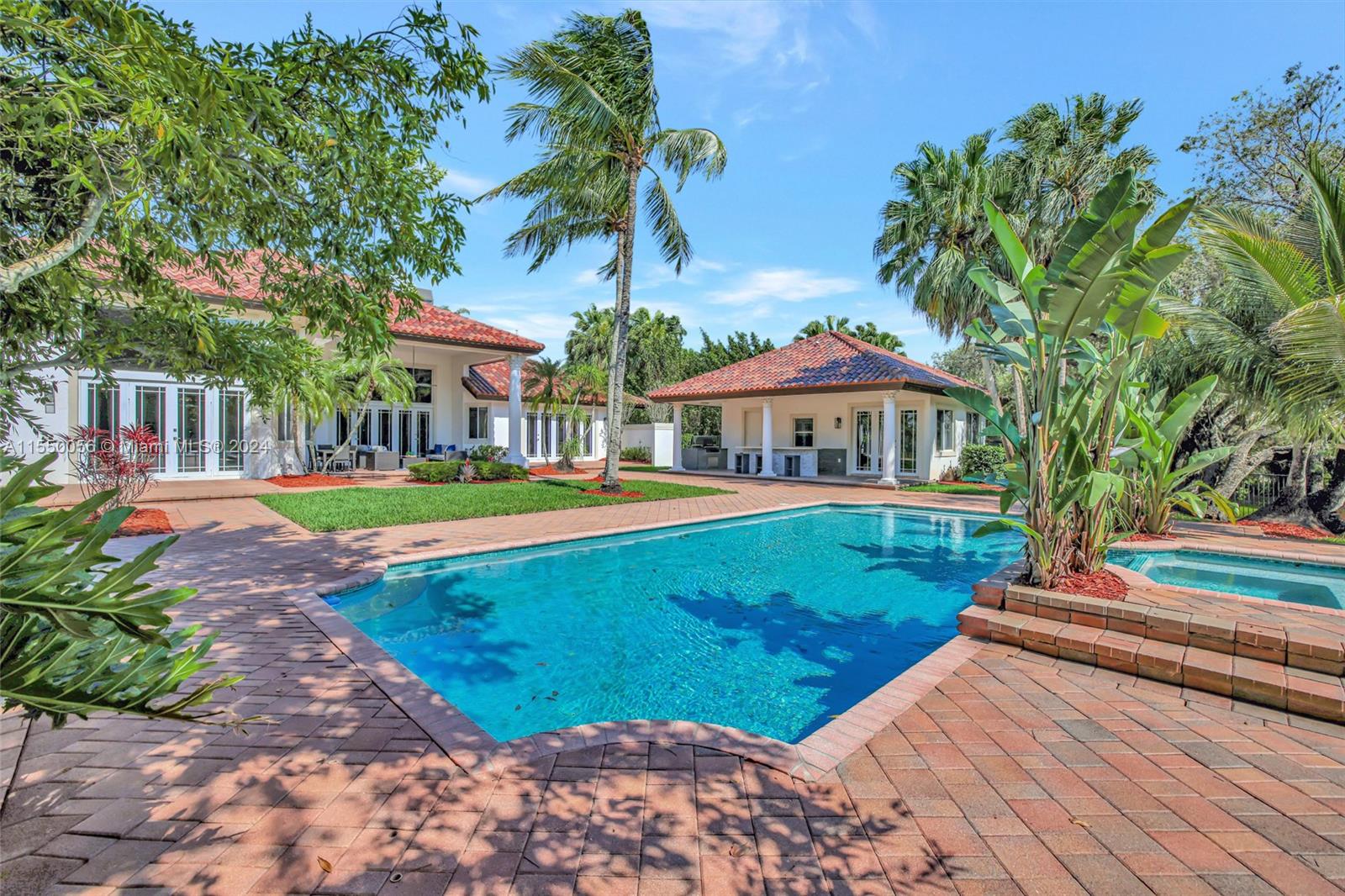 2725 Windmill Ranch Road Weston, FL 33331 - Photo 66 of 99 a front view of a house with a yard