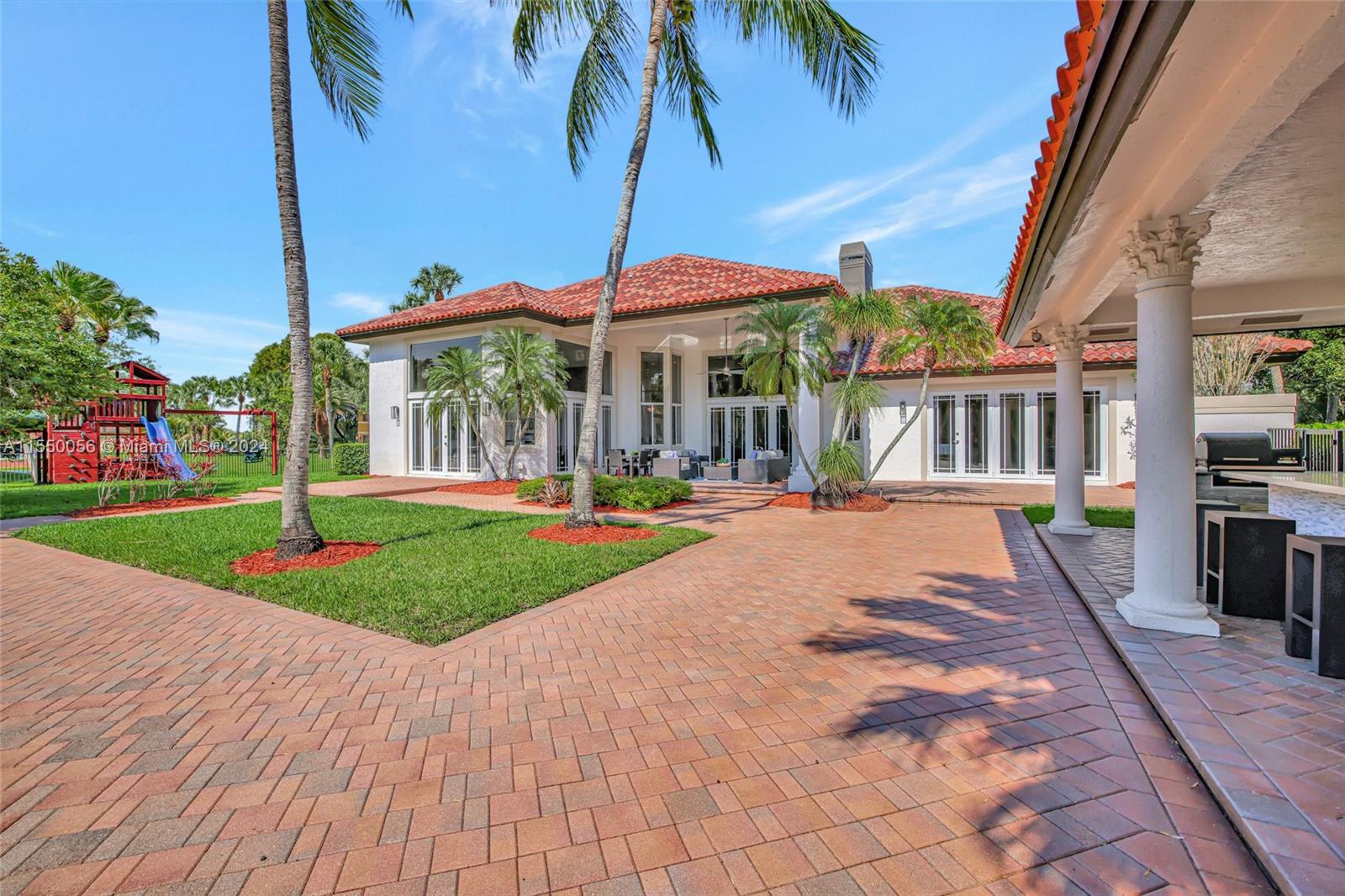 2725 Windmill Ranch Road Weston, FL 33331 - Photo 69 of 99 a view of outdoor space yard deck patio and swimming pool