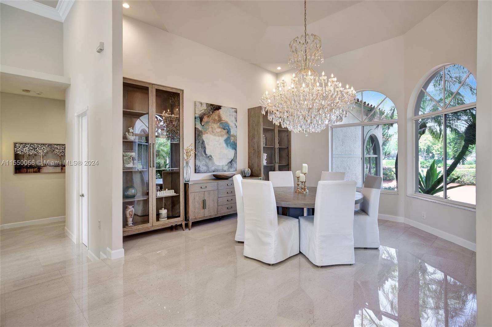 2725 Windmill Ranch Road Weston, FL 33331 - Photo 7 of 99 a view of a dining room with furniture and chandelier