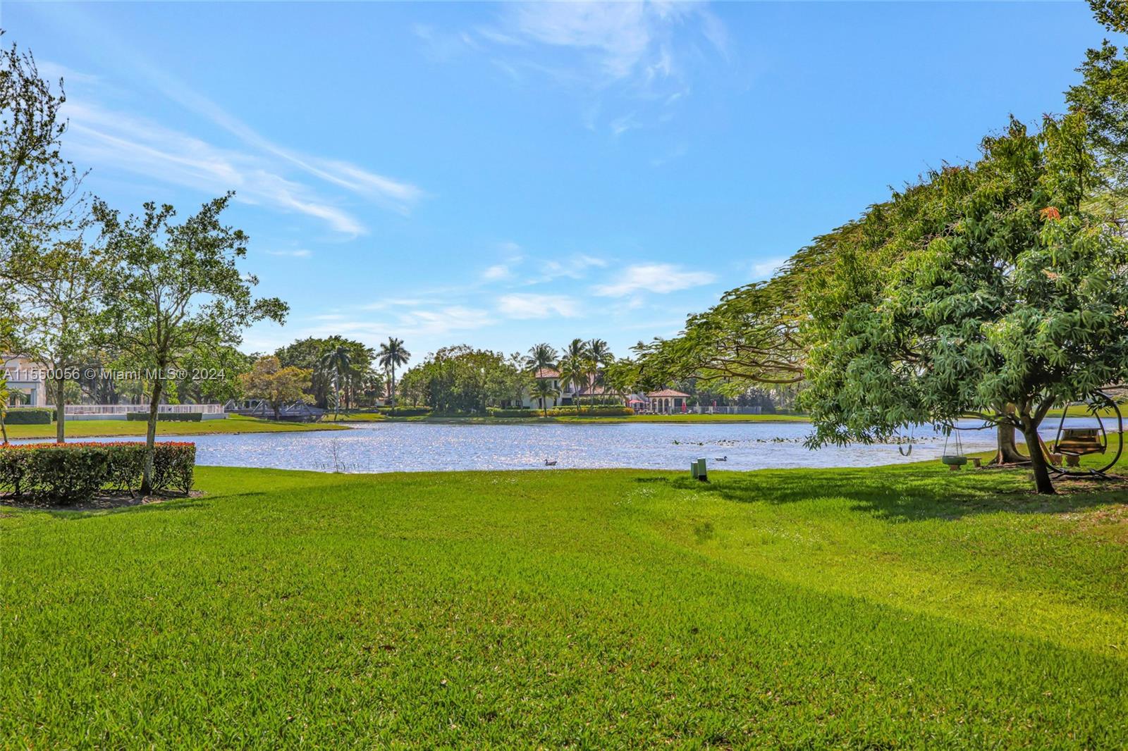 2725 Windmill Ranch Road Weston, FL 33331 - Photo 71 of 99 a view of a swimming pool with a yard