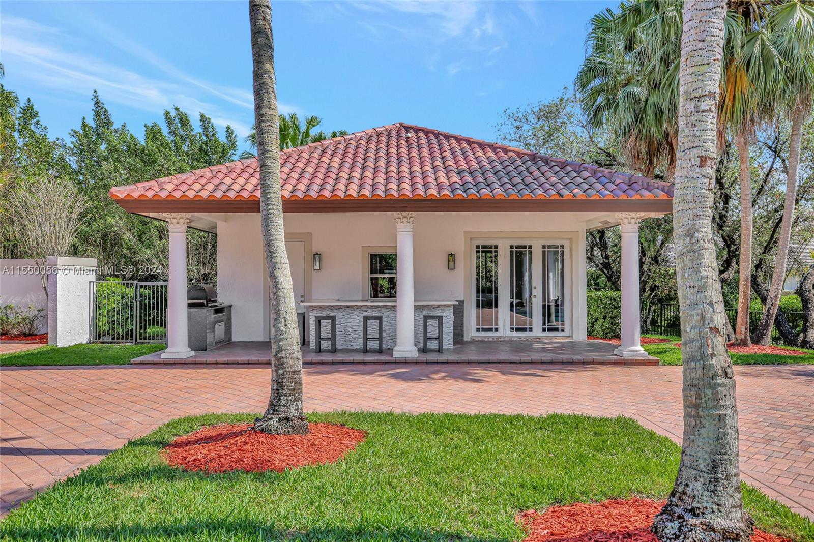 2725 Windmill Ranch Road Weston, FL 33331 - Photo 73 of 99 a front view of a house with swimming pool