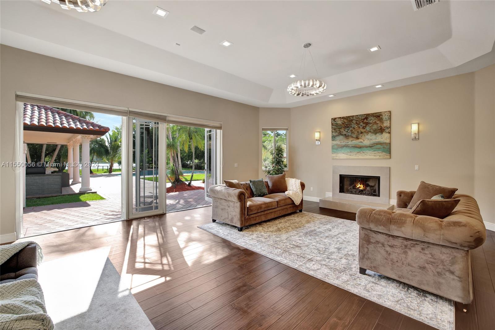 2725 Windmill Ranch Road Weston, FL 33331 - Photo 86 of 99 a living room with furniture and a fireplace