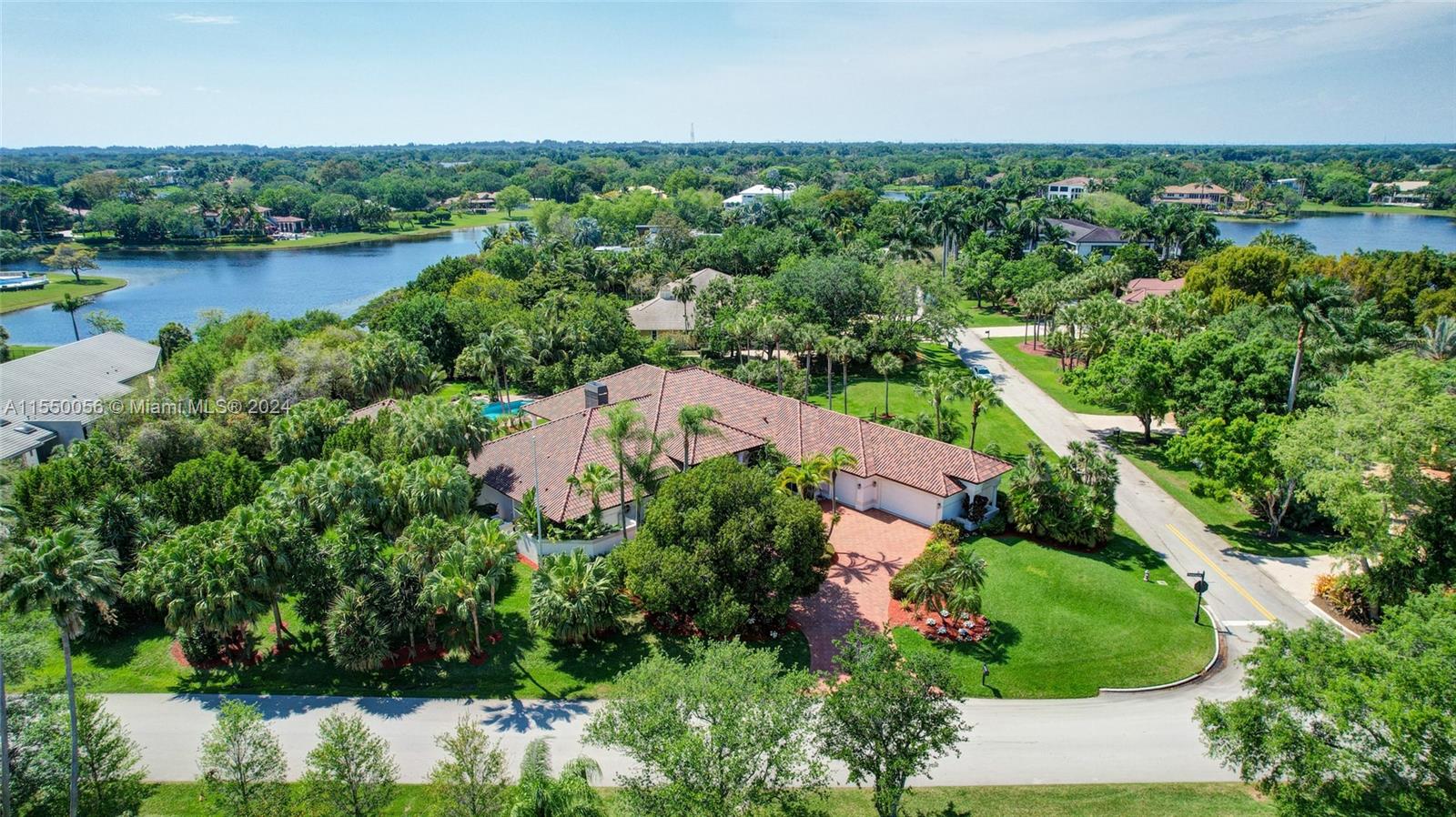 2725 Windmill Ranch Road Weston, FL 33331 - Photo 87 of 99 an aerial view of a house with a lake view