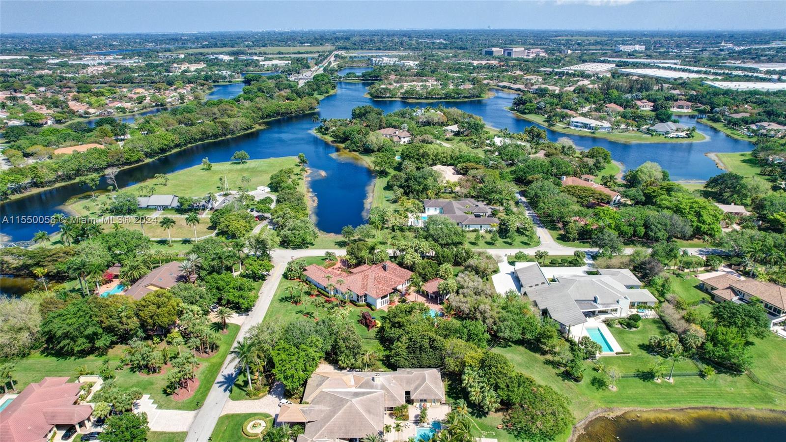 2725 Windmill Ranch Road Weston, FL 33331 - Photo 93 of 99 an aerial view of lake and residential houses with outdoor space