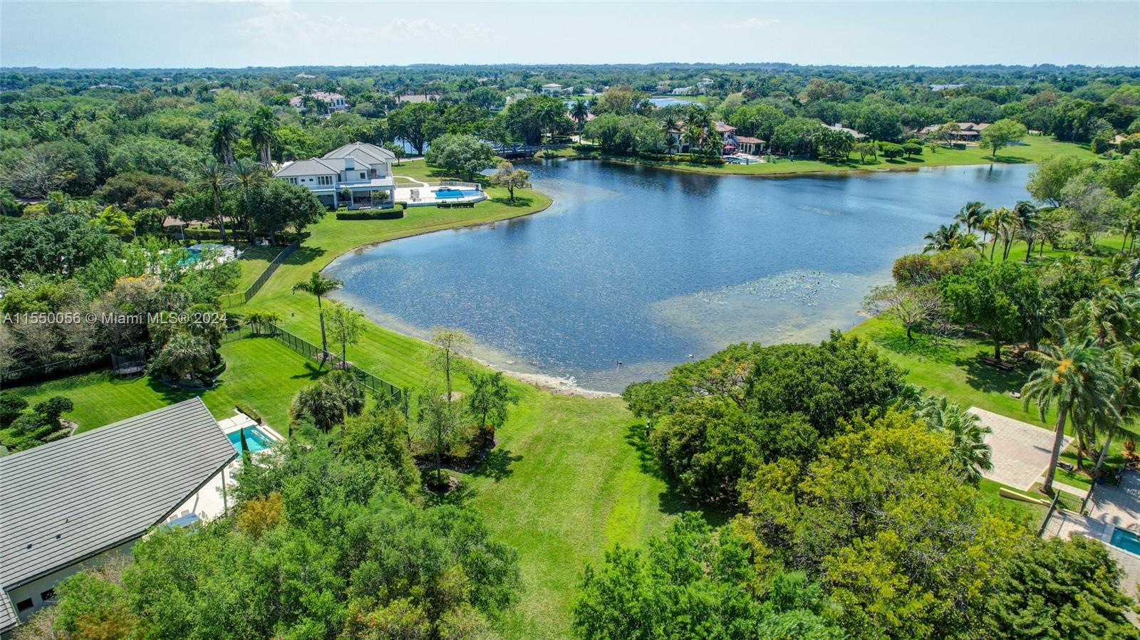 2725 Windmill Ranch Road Weston, FL 33331 - Photo 95 of 99 an aerial view of lake residential house with outdoor space and trees around