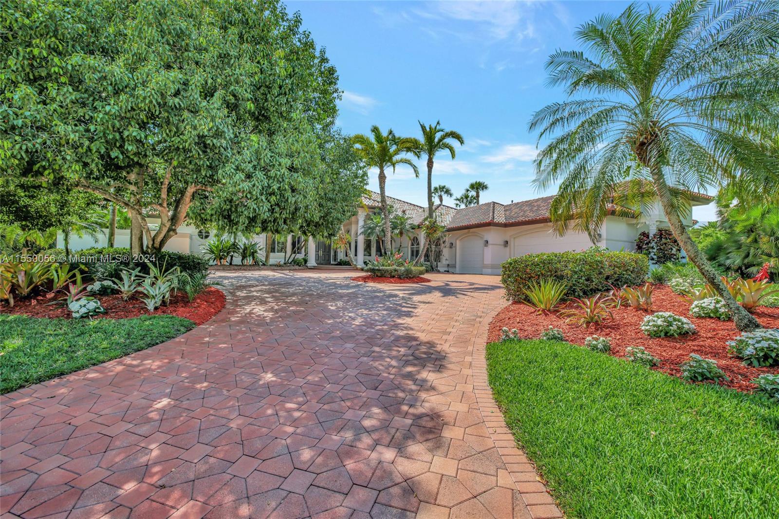 2725 Windmill Ranch Road Weston, FL 33331 - Photo 10 of 99 a view of a street with palm trees
