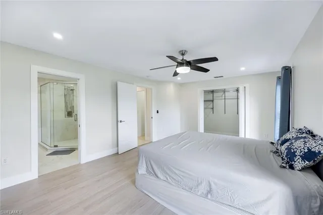 a bathroom with a double vanity sink mirror and shower