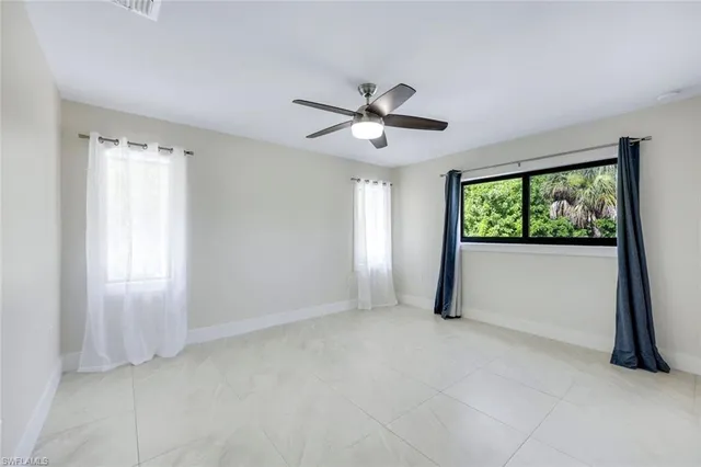 a bathroom with a sink double vanity granite toilet and shower