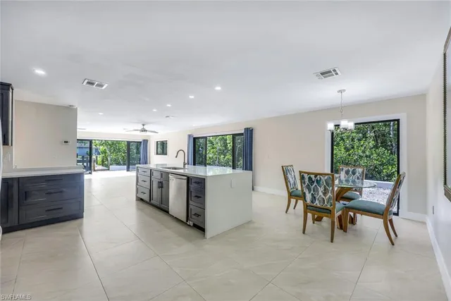 a kitchen with a table and chairs in it