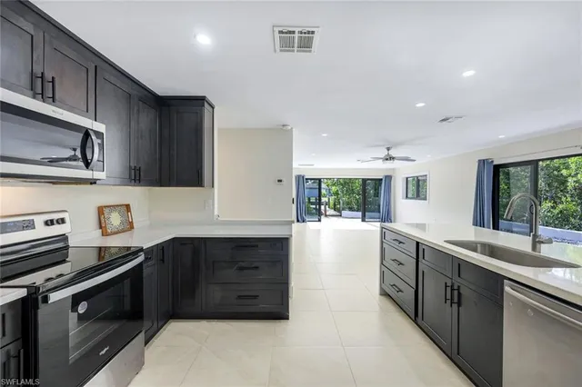 a view of a livingroom with an empty space and balcony