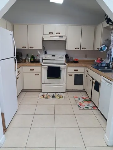 a view of a workspace with furniture