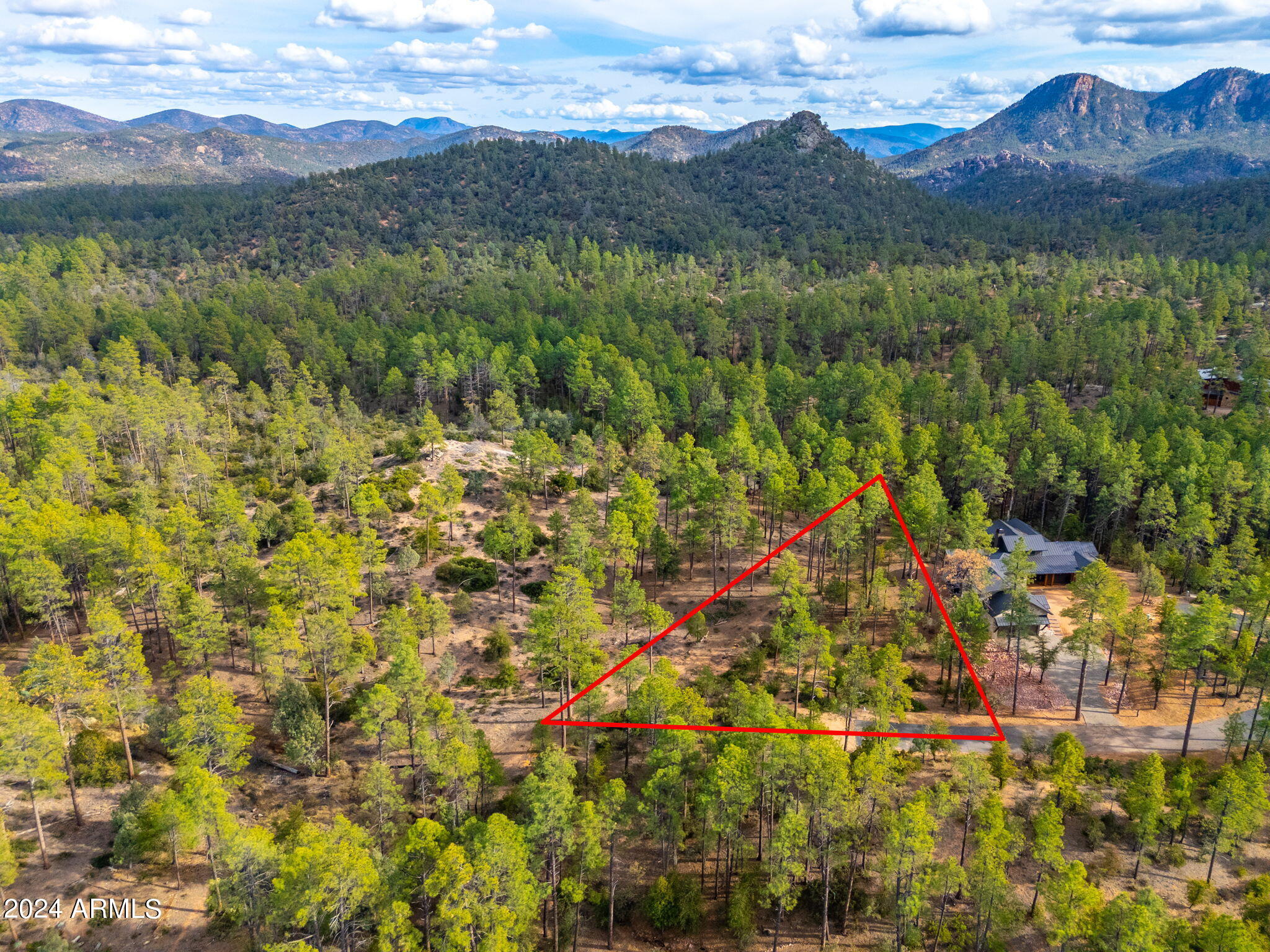 3109 East Game Trail, Unit 250 Payson, AZ 85541 - Photo 12 of 18 a view of a lush green hillside and a houses