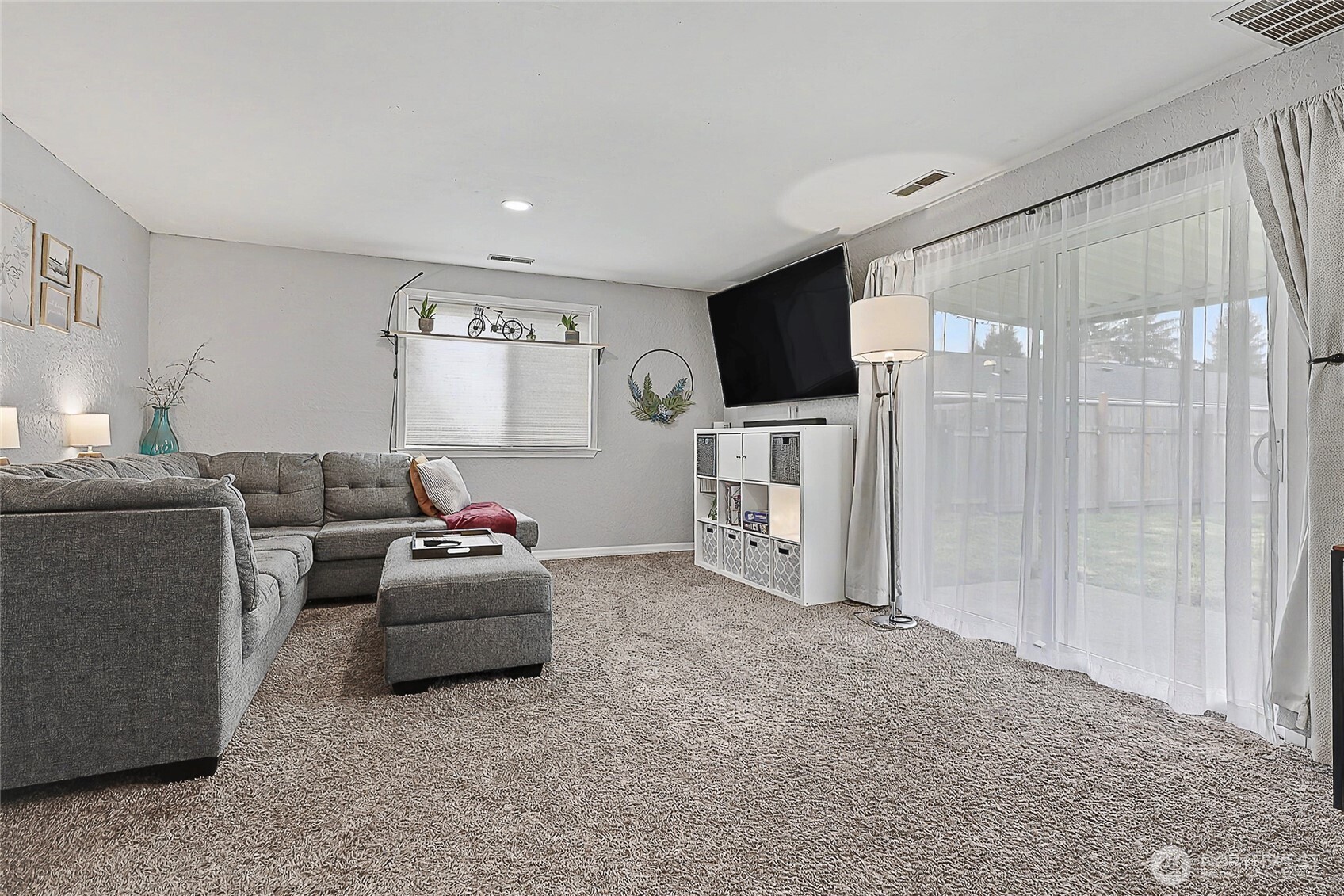 6003 Armour Loop Southeast Olympia, WA 98513 - Photo 13 of 25 a living room with furniture and a flat screen tv
