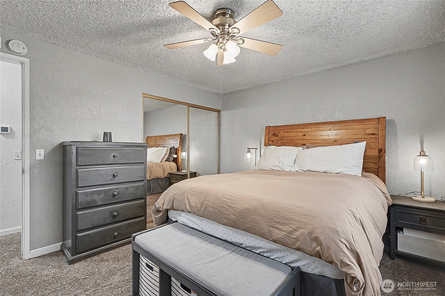 6003 Armour Loop Southeast Olympia, WA 98513 - Photo 15 of 25 a bedroom with a bed and a chandelier