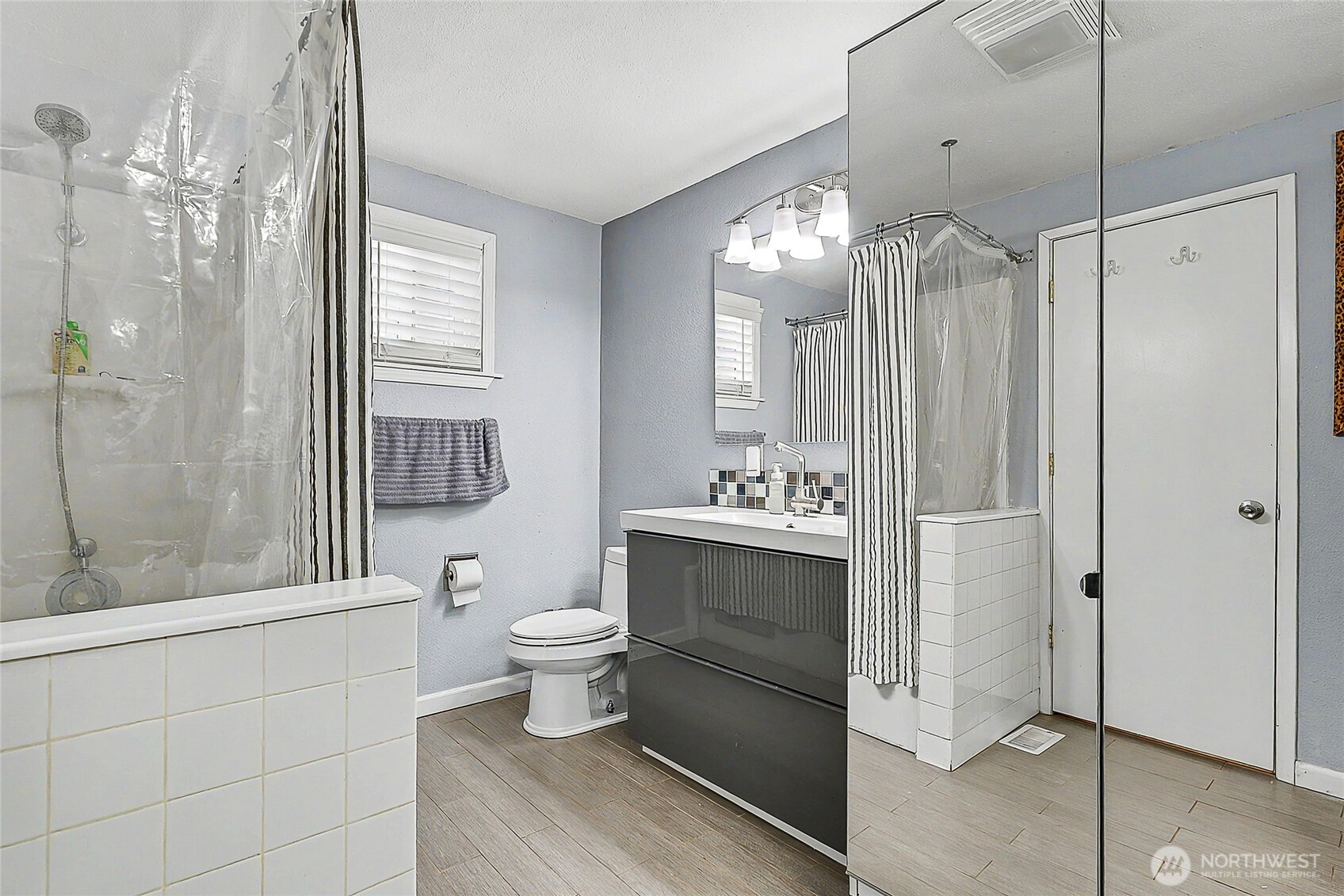 6003 Armour Loop Southeast Olympia, WA 98513 - Photo 18 of 25 a bathroom with a toilet a sink and shower