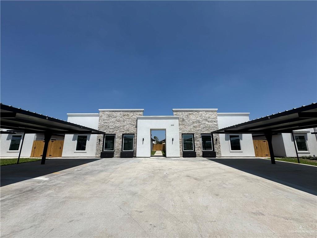 a front view of a large building with large windows