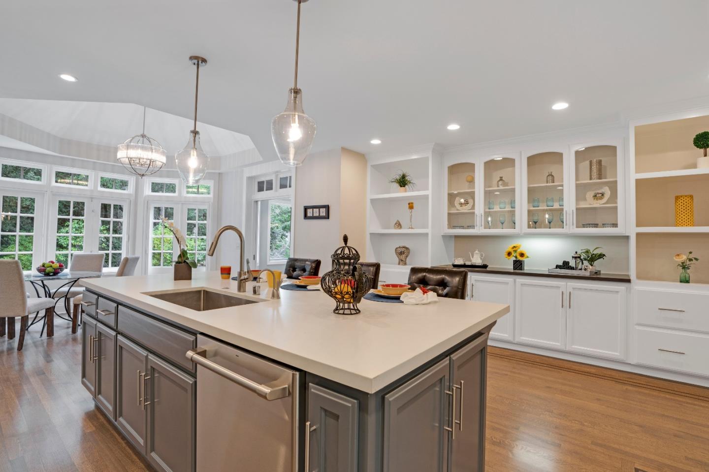 17915 Foster Road Los Gatos, CA 95030 - Photo 11 of 30 a kitchen with stainless steel appliances a sink a stove a center island and a wooden floor