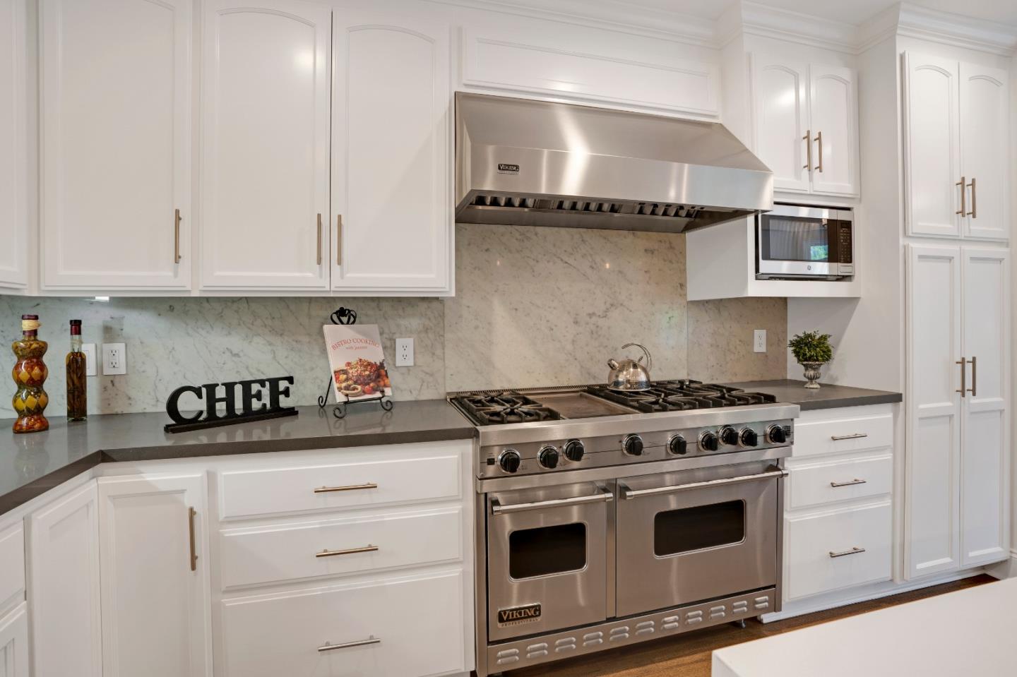 17915 Foster Road Los Gatos, CA 95030 - Photo 12 of 30 a kitchen with white cabinets and appliances