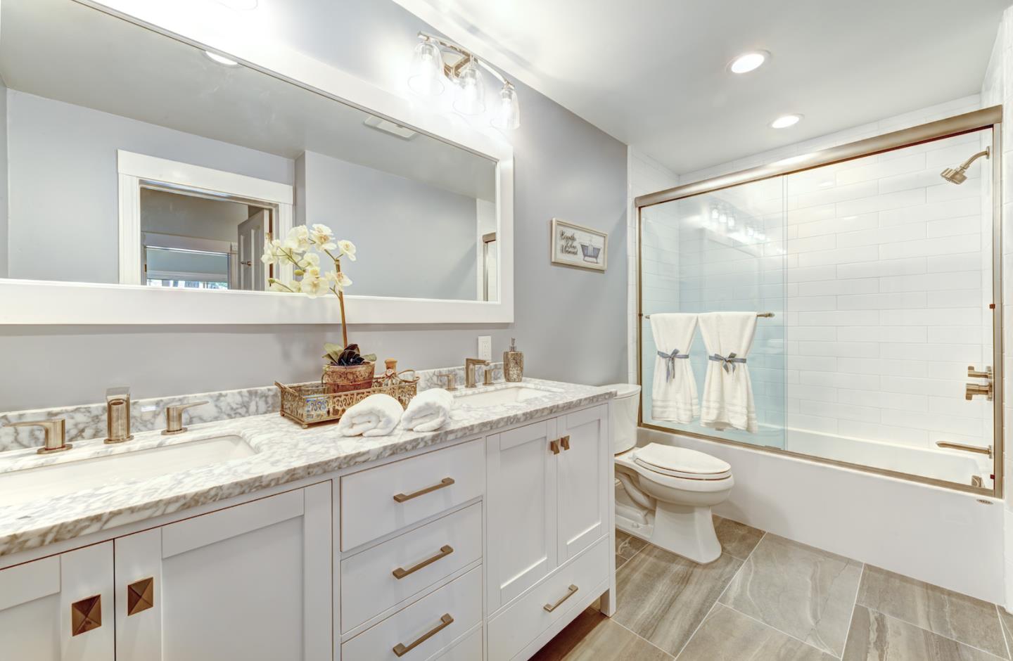 17915 Foster Road Los Gatos, CA 95030 - Photo 17 of 30 a bathroom with a granite countertop sink mirror vanity and toilet