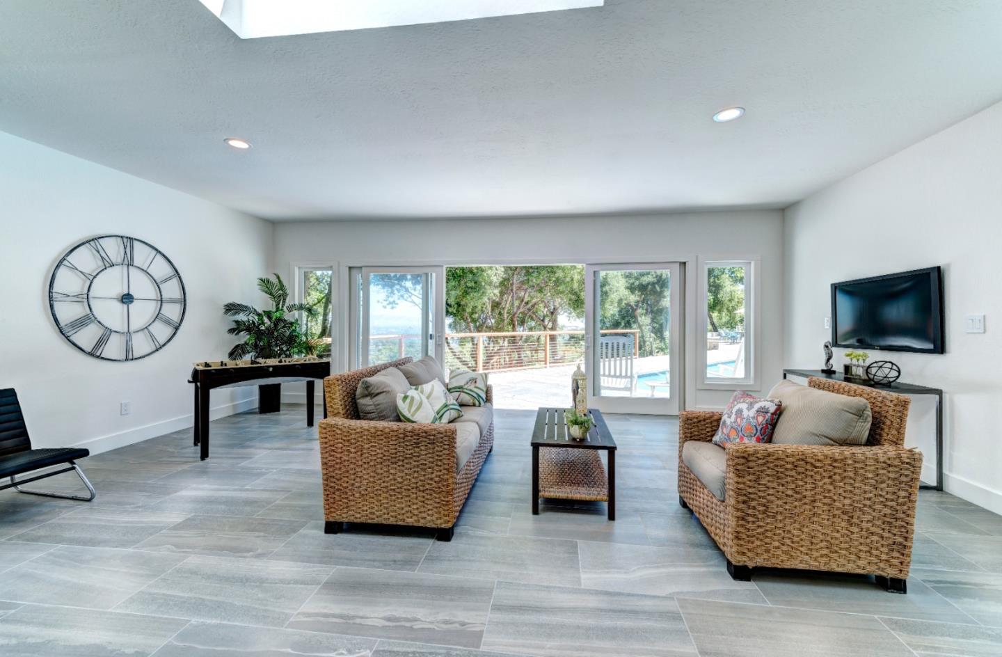 17915 Foster Road Los Gatos, CA 95030 - Photo 22 of 30 a living room with furniture and a flat screen tv