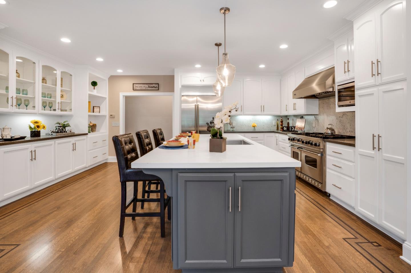 17915 Foster Road Los Gatos, CA 95030 - Photo 10 of 30 a kitchen with a table chairs stove and microwave