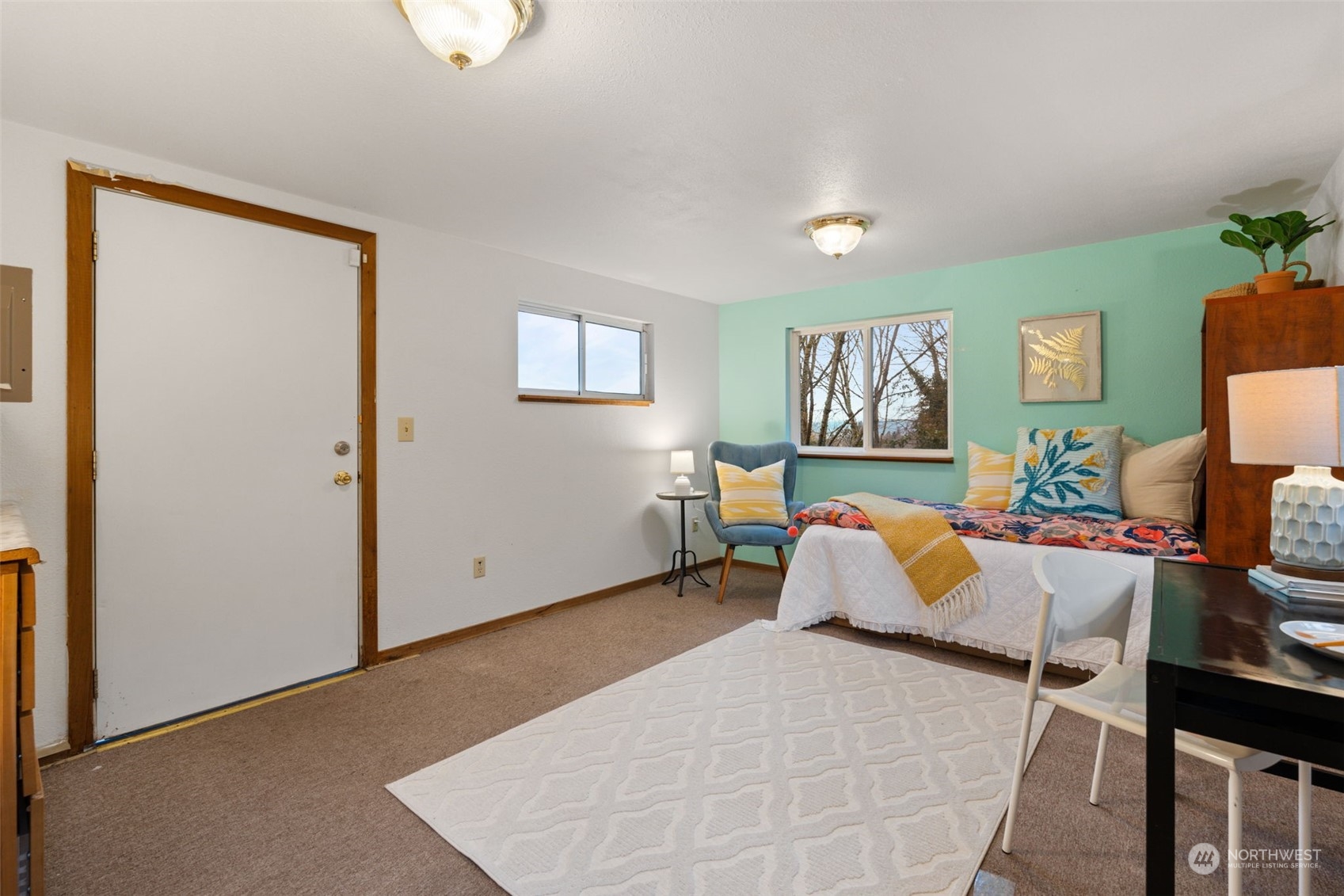 913 Powell Street Steilacoom, WA 98388 - Photo 22 of 40 a bedroom with a bed and couch