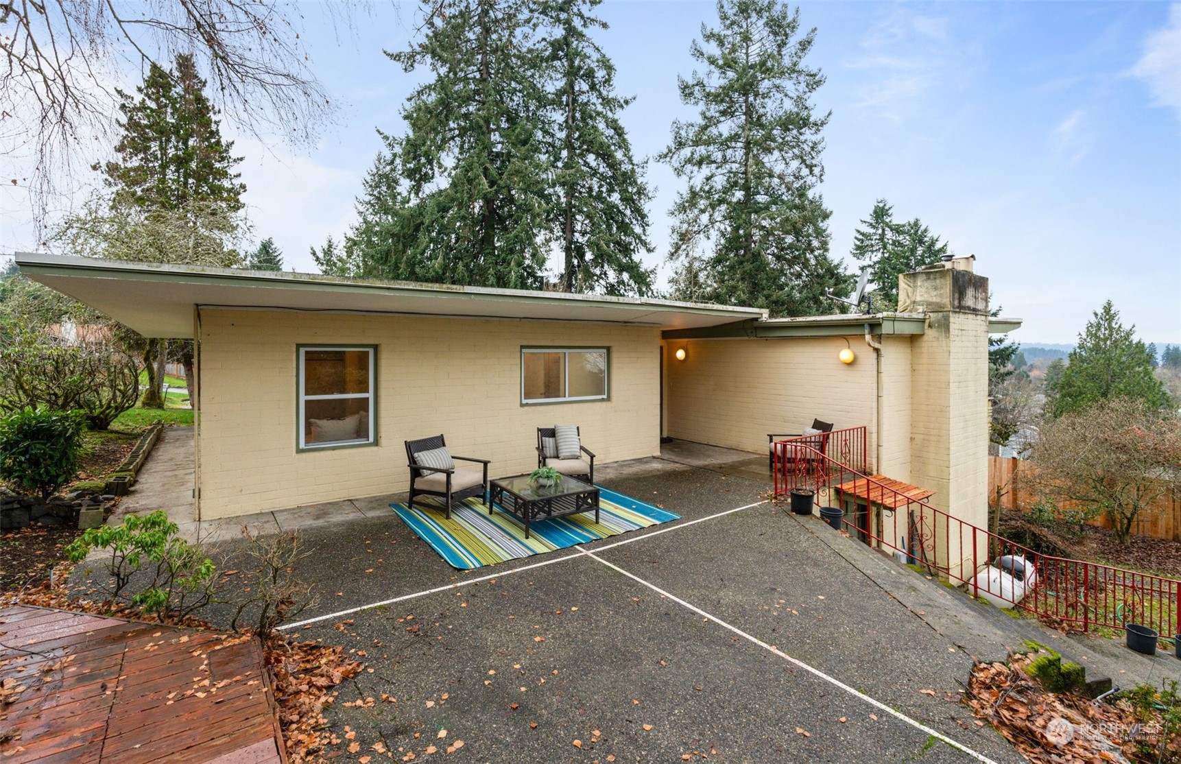 913 Powell Street Steilacoom, WA 98388 - Photo 32 of 40 a view of a house with backyard and sitting area