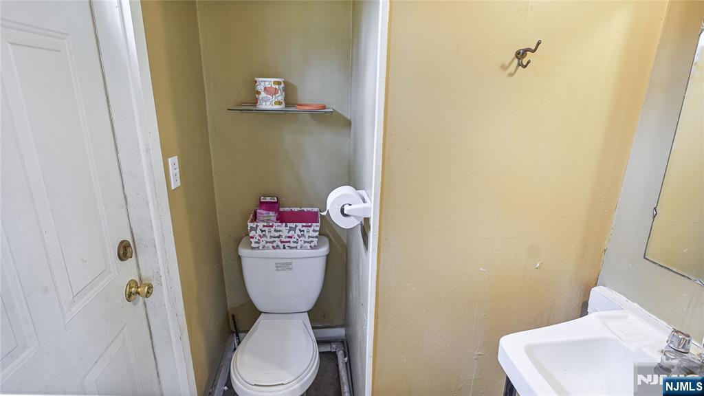695 Ramapo Valley Road Oakland, NJ 07436 - Photo 41 of 42 a bathroom with a toilet and a sink