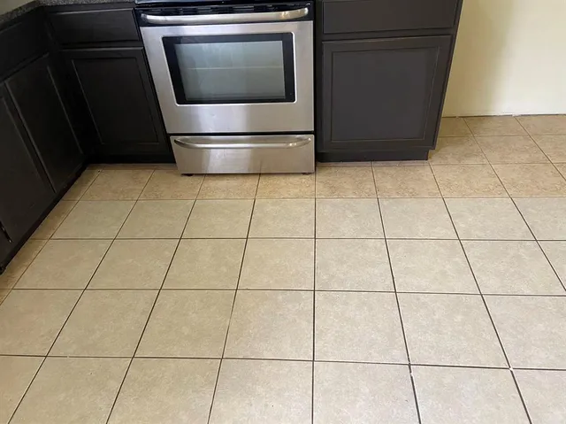 a view of a utility room and empty room