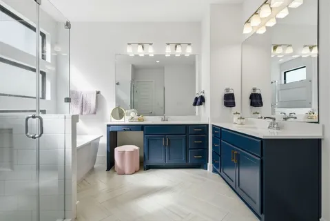 a bathroom with a double vanity sink mirror and double