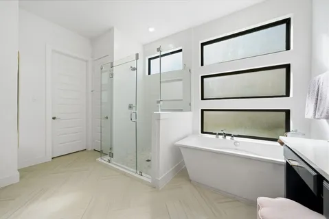 a room with a window and a mirror