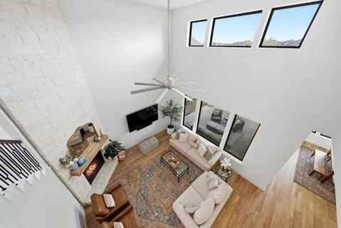 a view of a workspace with furniture and wooden floor