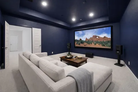 a bedroom with furniture and a flat screen tv
