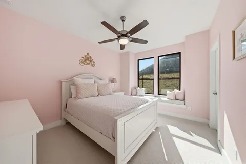 a bedroom with a bed and window