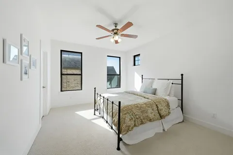 a bedroom with a bed and window