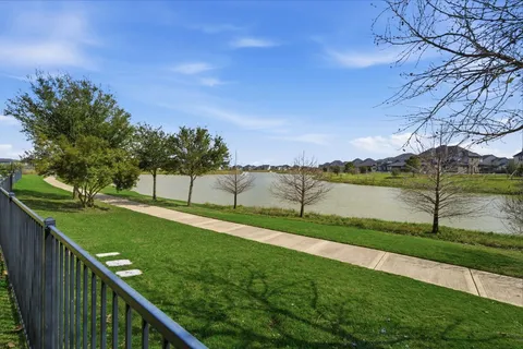 a view of a lake with a big yard