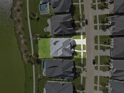 an aerial view of houses with outdoor space