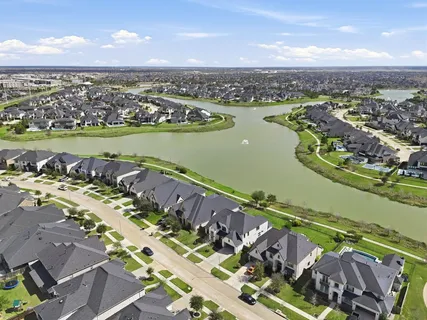an aerial view of a city with a lake view