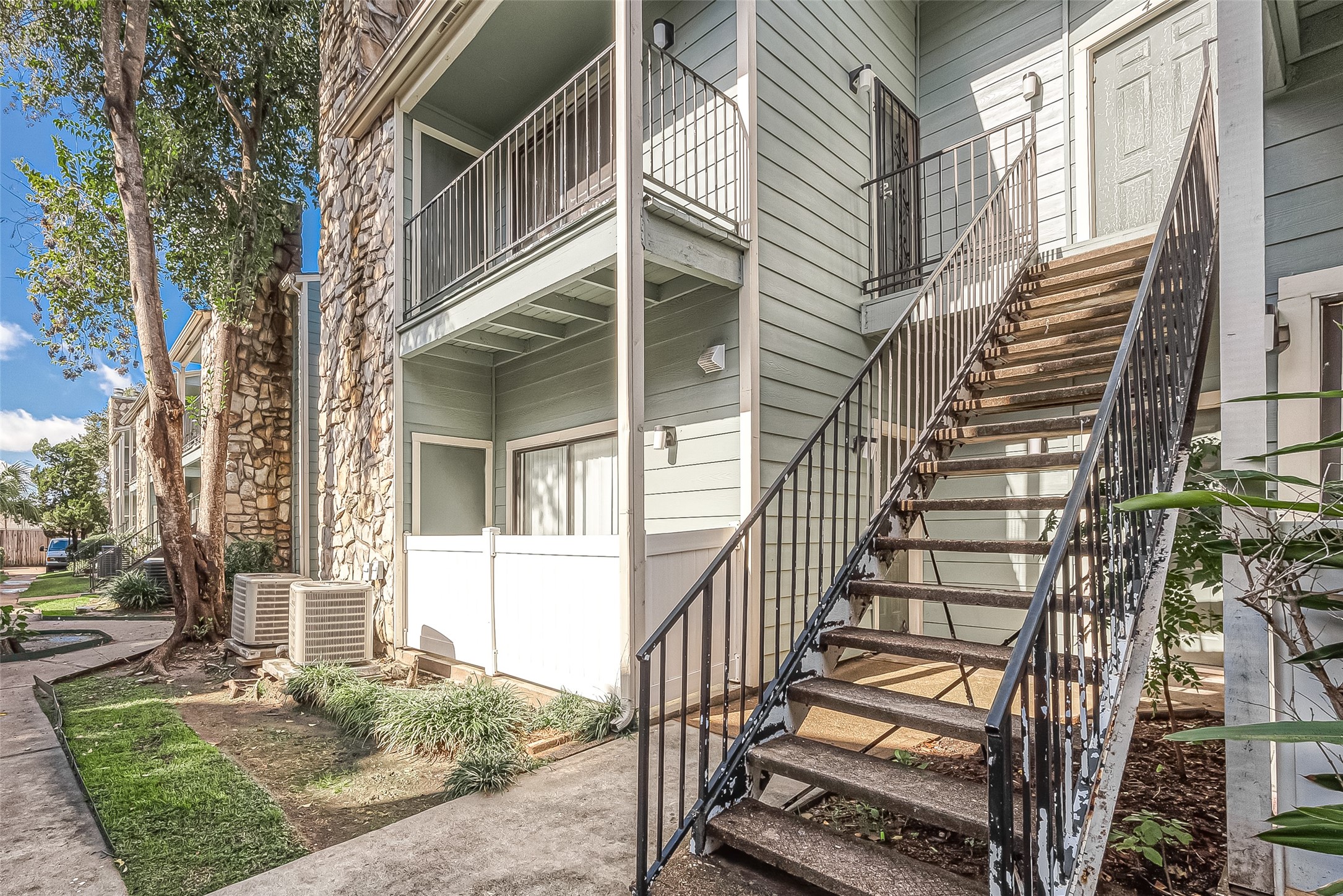 3758 Tanglewilde Street, Unit 2 Houston, TX 77063 - Photo 2 of 23 front view of a house with a yard