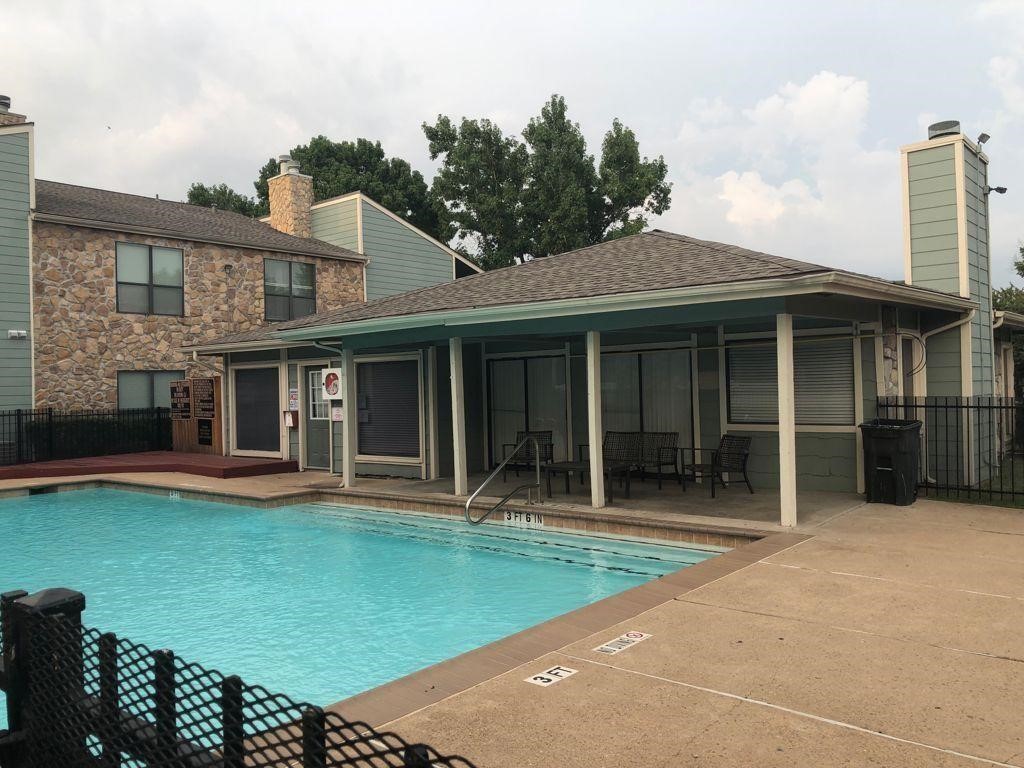 3758 Tanglewilde Street, Unit 2 Houston, TX 77063 - Photo 22 of 23 a front view of a house with a garden and porch